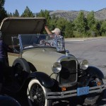 Larry and Linda in the process of putting up their back window. They have yet to travel with the top down.