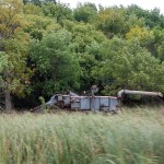 No buttes in Minnesota to enshrine this old threshing machine.